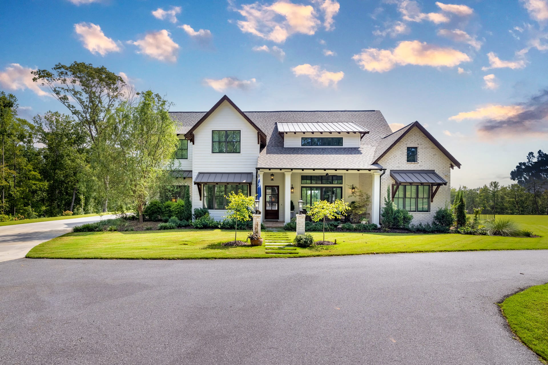 Brick and board-and-batten siding define the Newton front elevation.