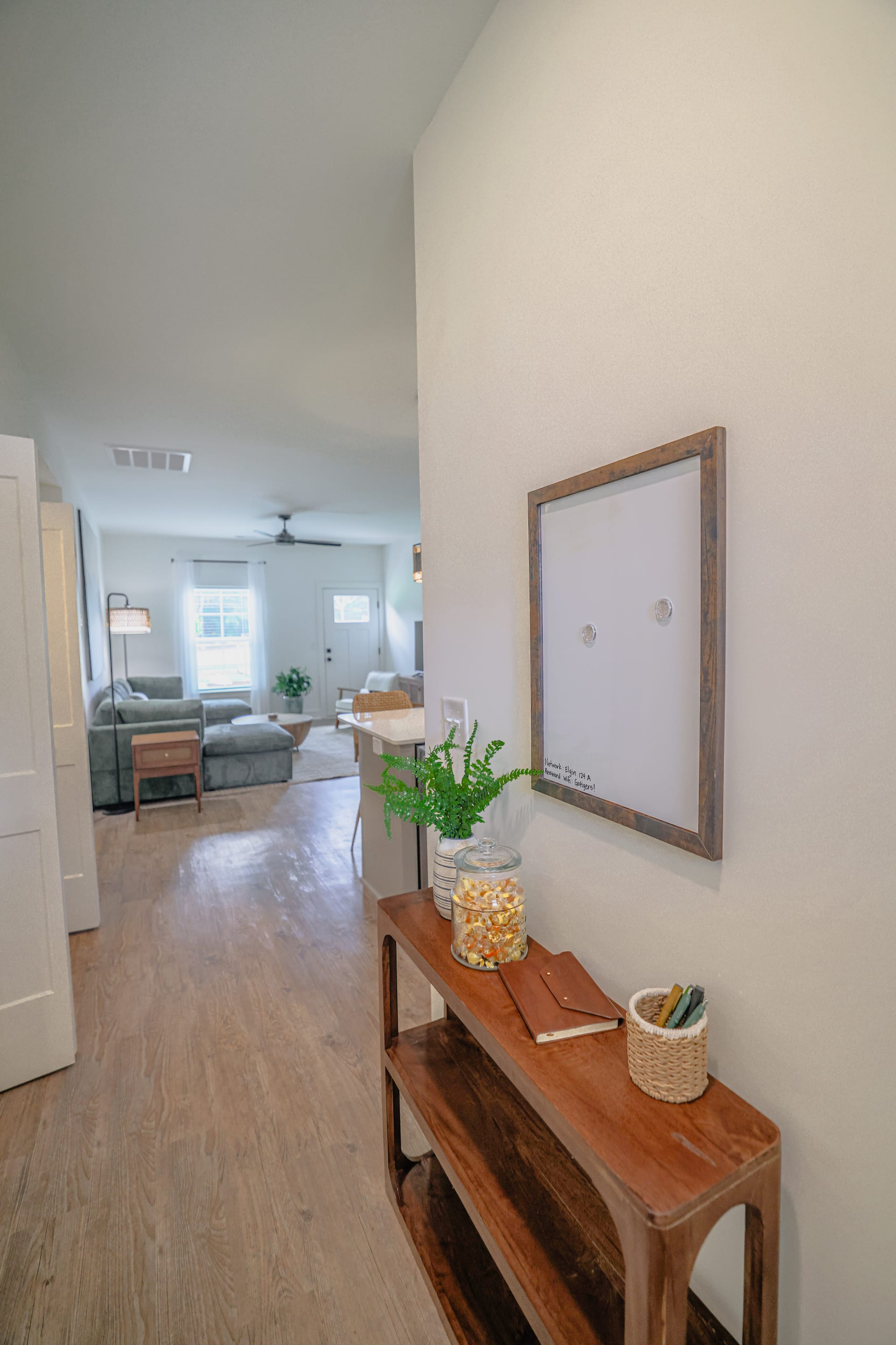 A rustic console anchors the entry with textured charm and understated welcome.