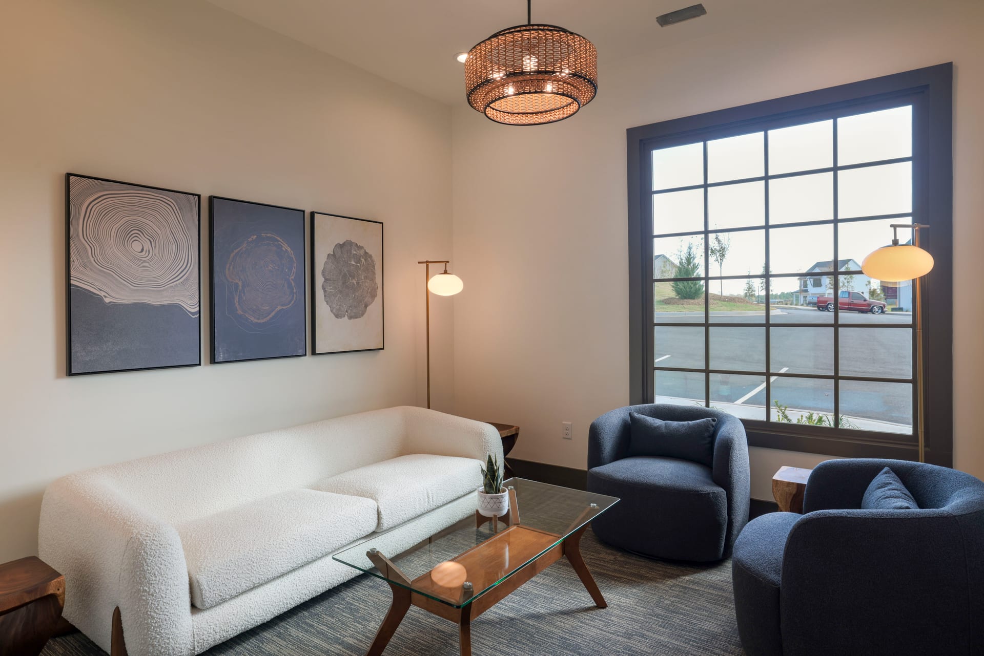Boucle sofa and abstract art turn the meeting room into a design statement.