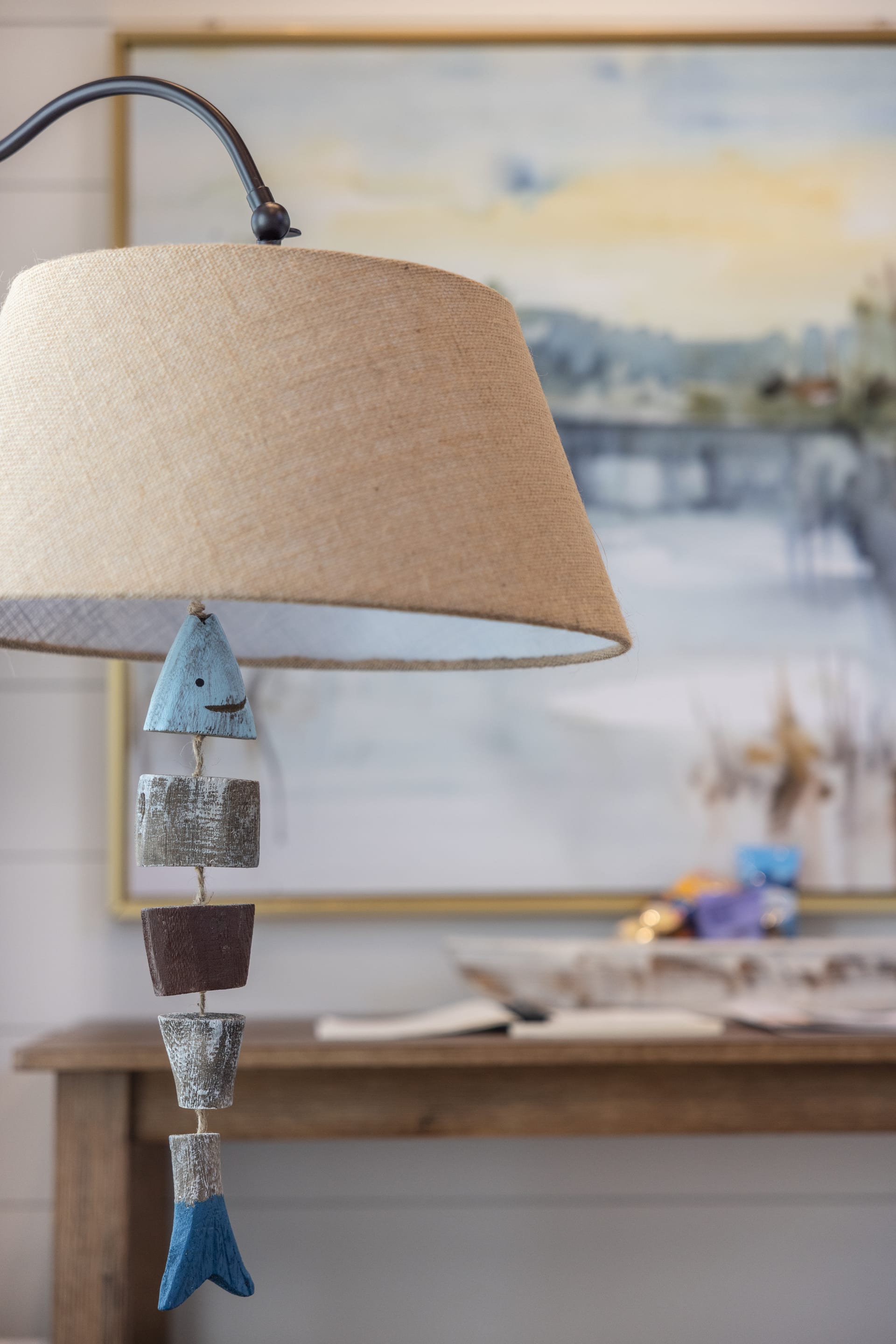 Burlap lamp and carved fish details layer lakeside character into every corner.