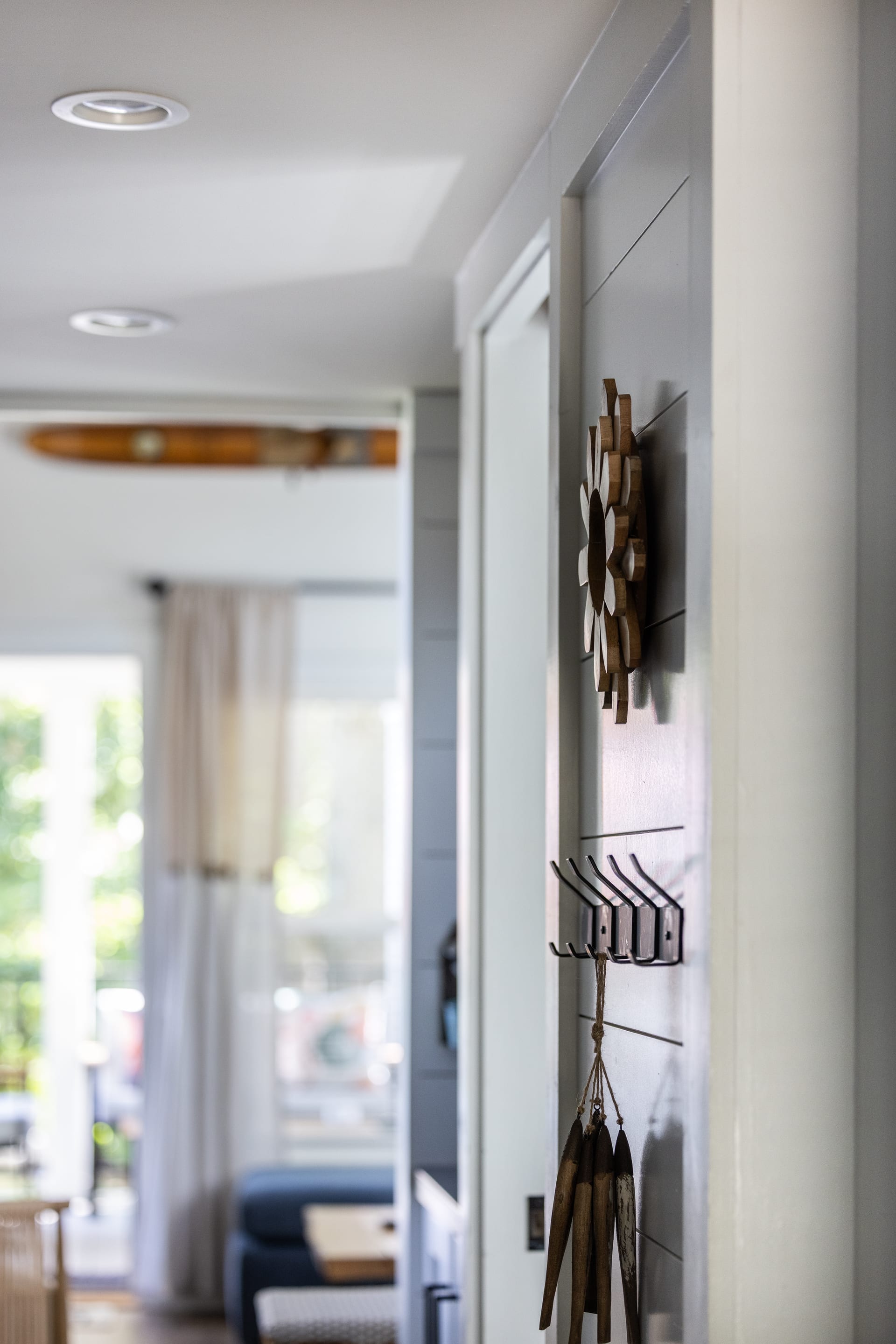 Shiplap walls and a starburst mirror greet guests in the Shiloh entry.